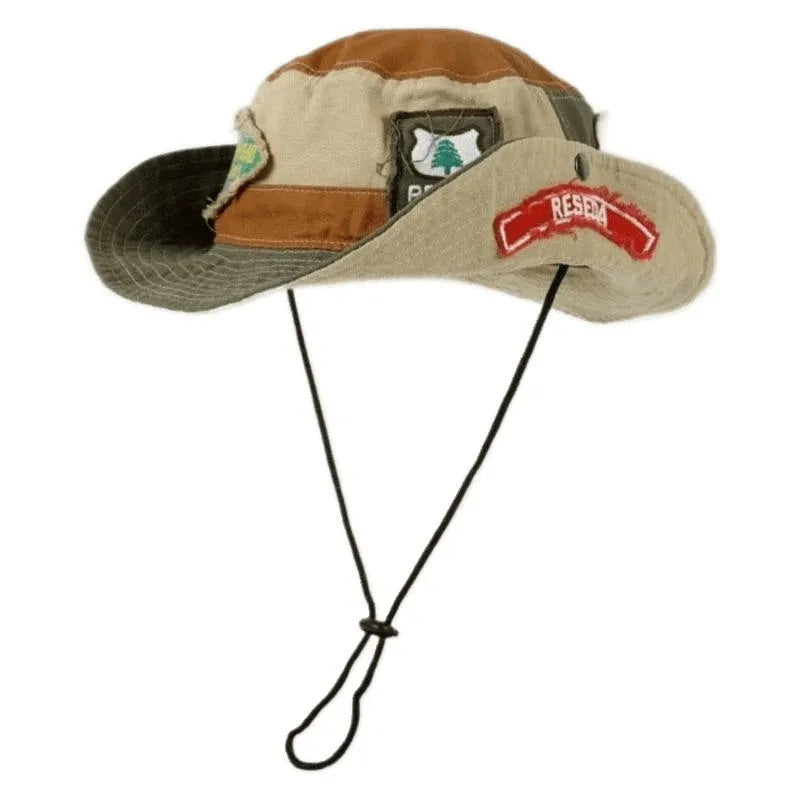 Army green cotton fisherman hat with patchwork details and flat-top crown, folded for display