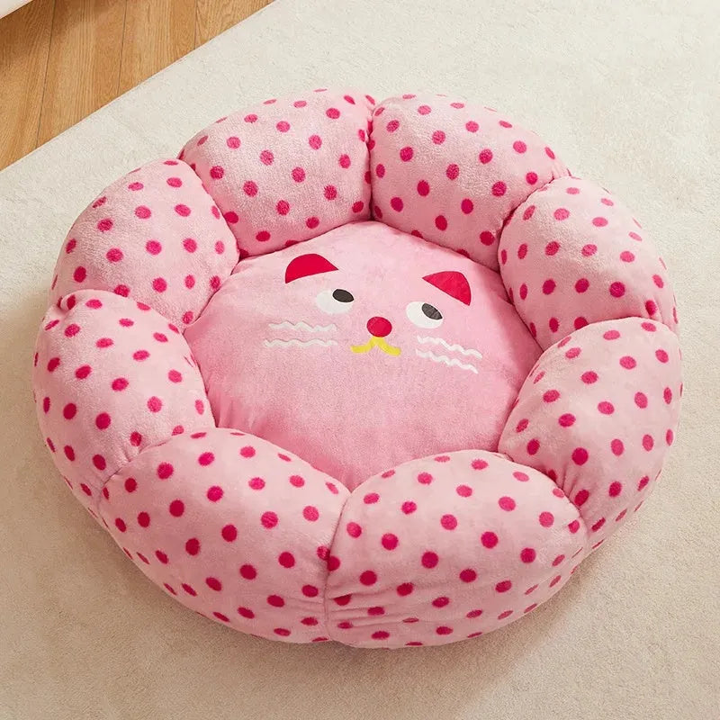 Round pink cat bed with dot pattern and cushion for indoor sleeping