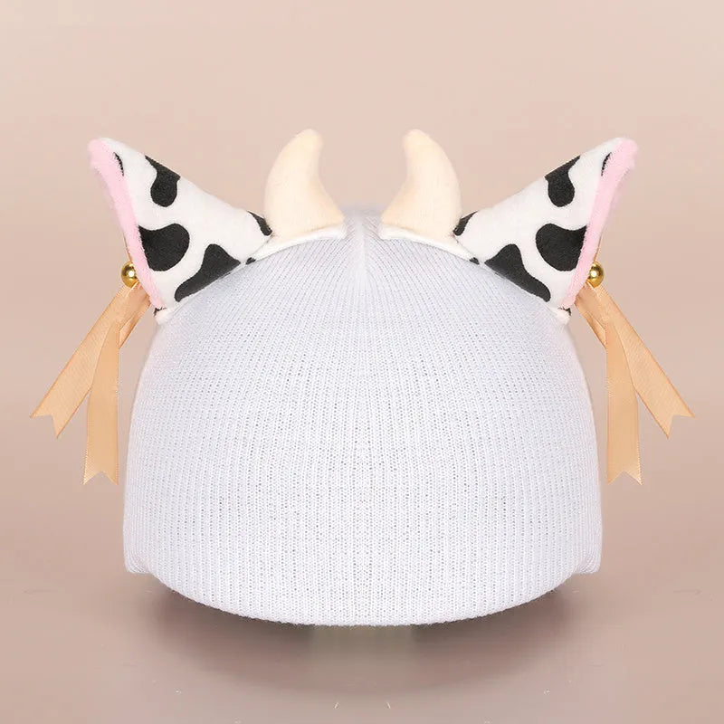 Cute plush cartoon animal character hat designed to decorate a standard ski helmet.