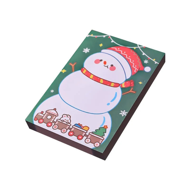 Christmas sticky notes book showing eight cartoon designs including Santa Claus, Christmas Elf, and Snowman