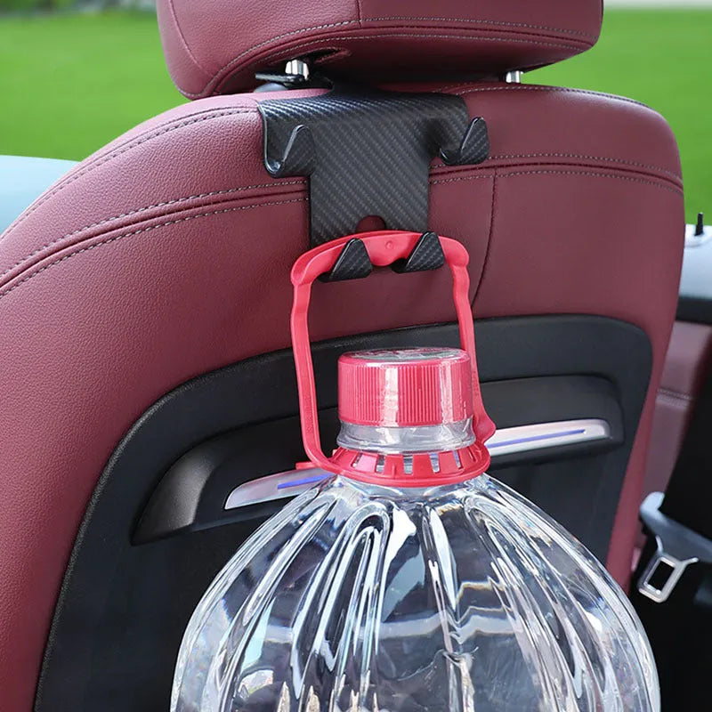 Black ABS plastic car hook with integrated mobile phone holder bracket for rear seat backs.