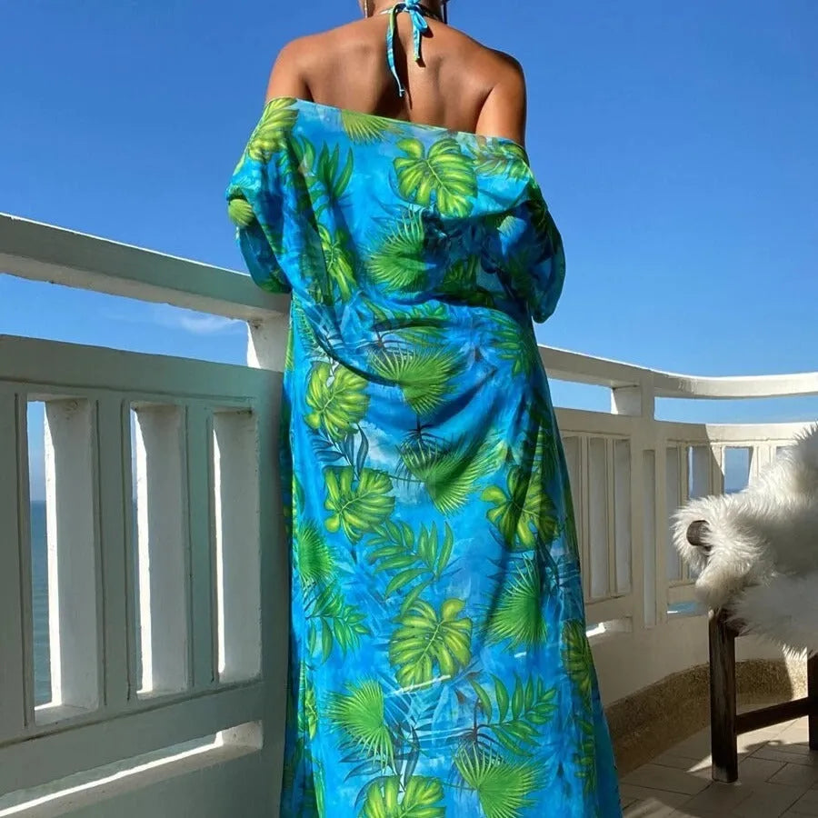 Women's long sleeve bikini set with floral pattern and matching robe on a hanger.