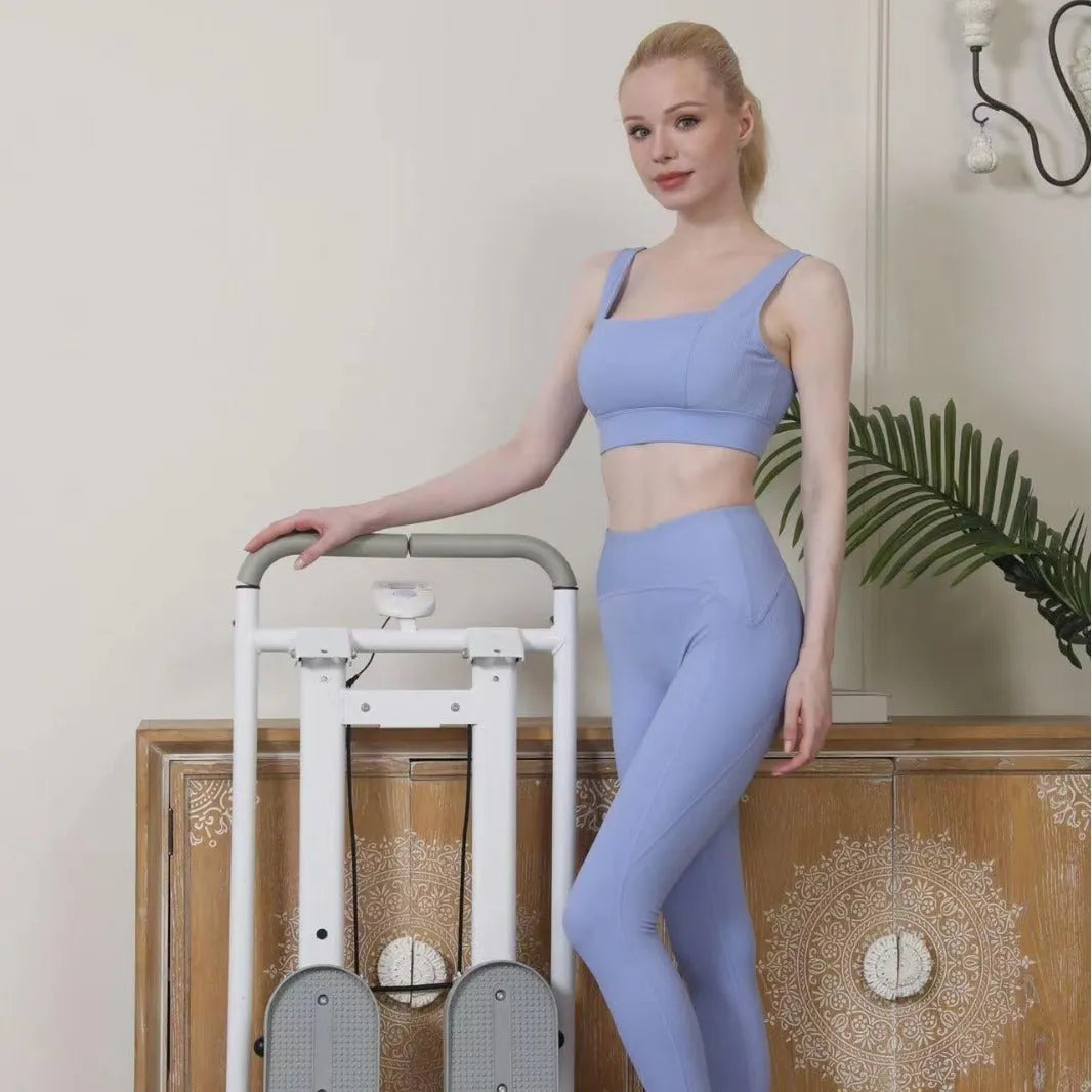 White folding treadmill with integrated climbing frame for home fitness workouts