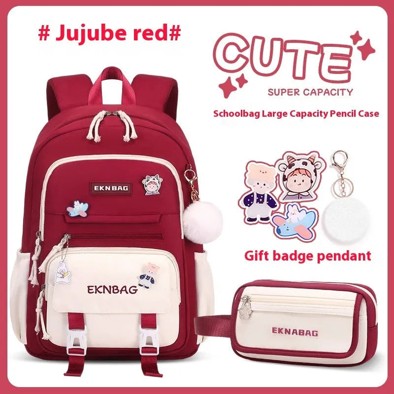 Pink waterproof Oxford cloth school backpack for girls with curved shoulder straps on a white background.
