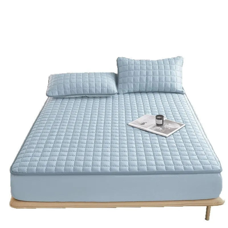 Blue waterproof fitted sheet with elasticated corner on a mattress