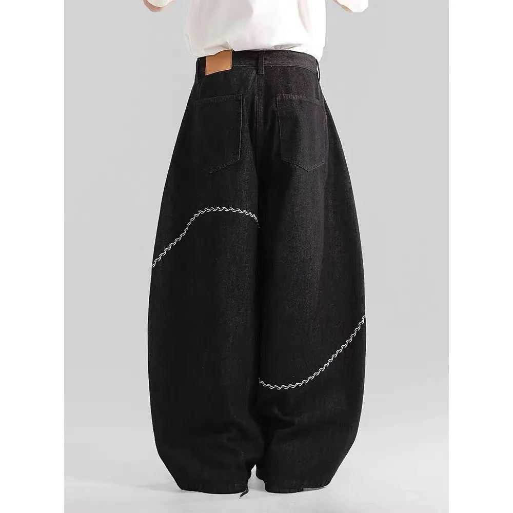 Black straight-leg polyester denim trousers on a hanger, showing mid-waist fit and zip fly.