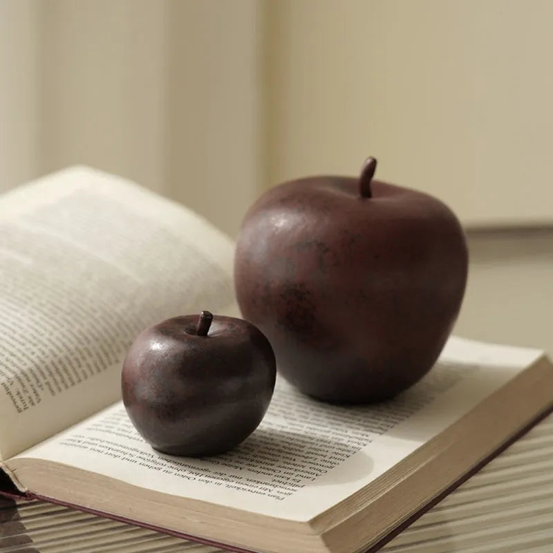 Ceramic apple decoration ornament on a desk, shown in large and small size options.