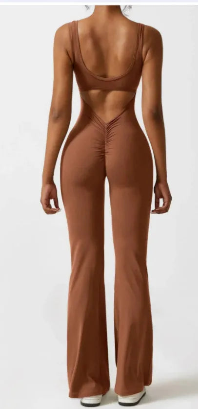 Women's black milk silk yoga bodysuit with hollow back and seamless construction on a mannequin.