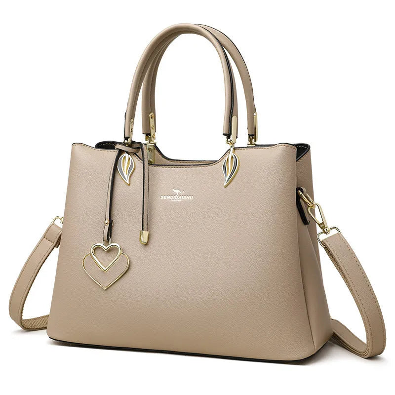 Women's black PU leather multi-compartment shoulder messenger bag with adjustable strap.