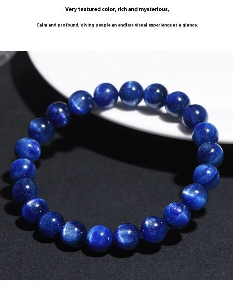 Natural blue crystal ball bracelet with geometric shape and Ruyi detail on a white background.