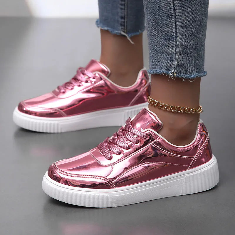 Rose gold platform sneaker with sequin details and a thick, light-coloured sole.