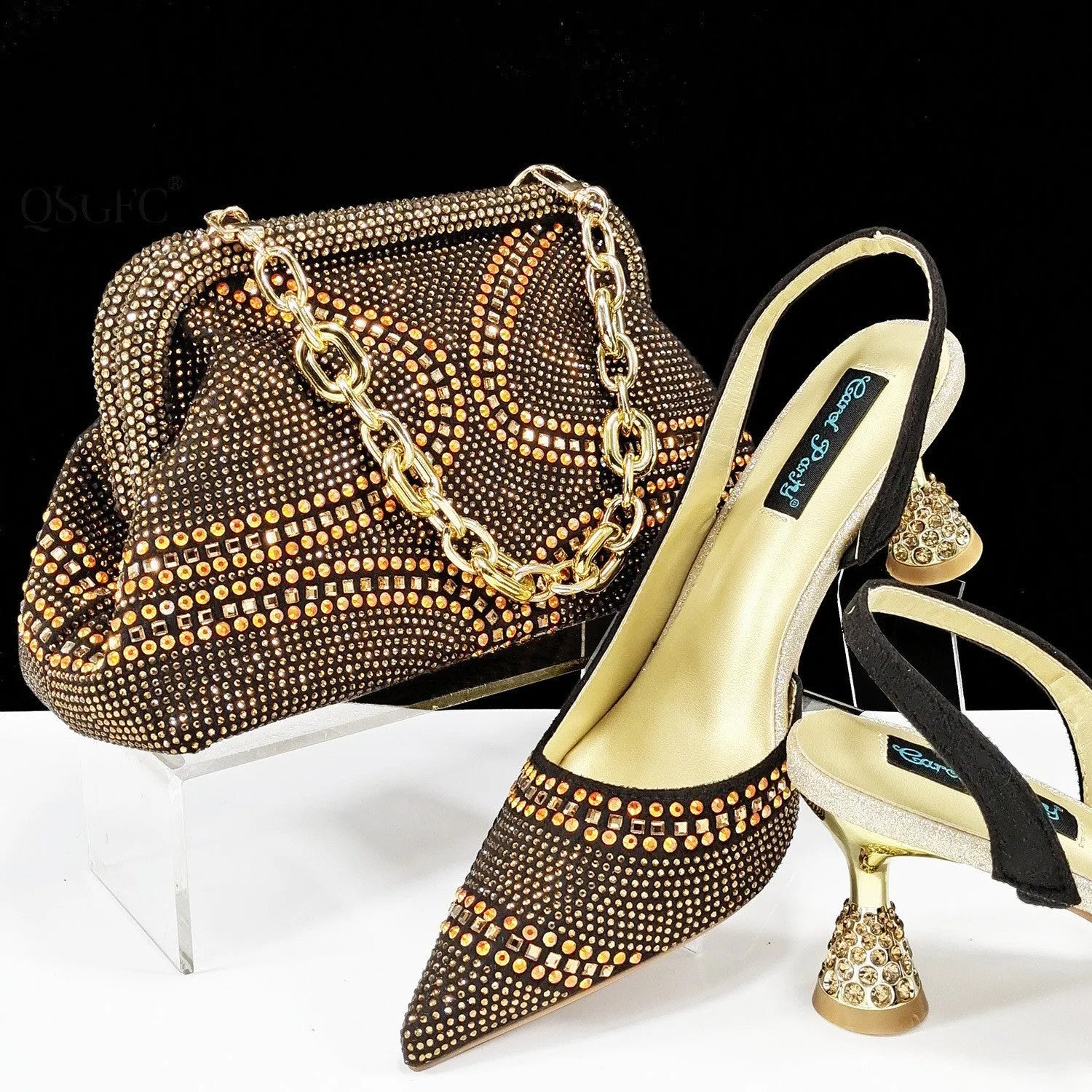 Women's pointed toe high heels with rhinestone details and matching small bag in synthetic leather