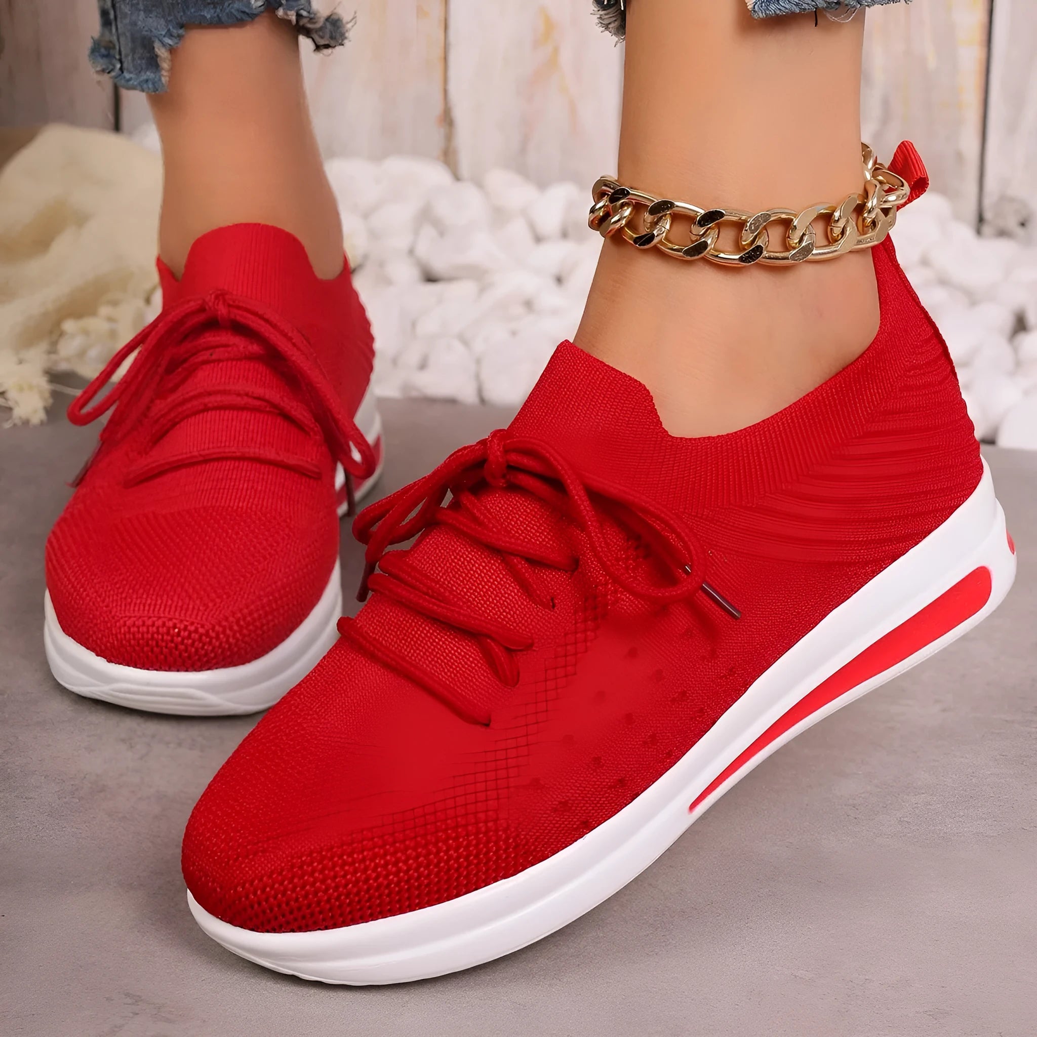 Women's low-top casual sneakers in red, black, or blue with round toe and front lace-up design.