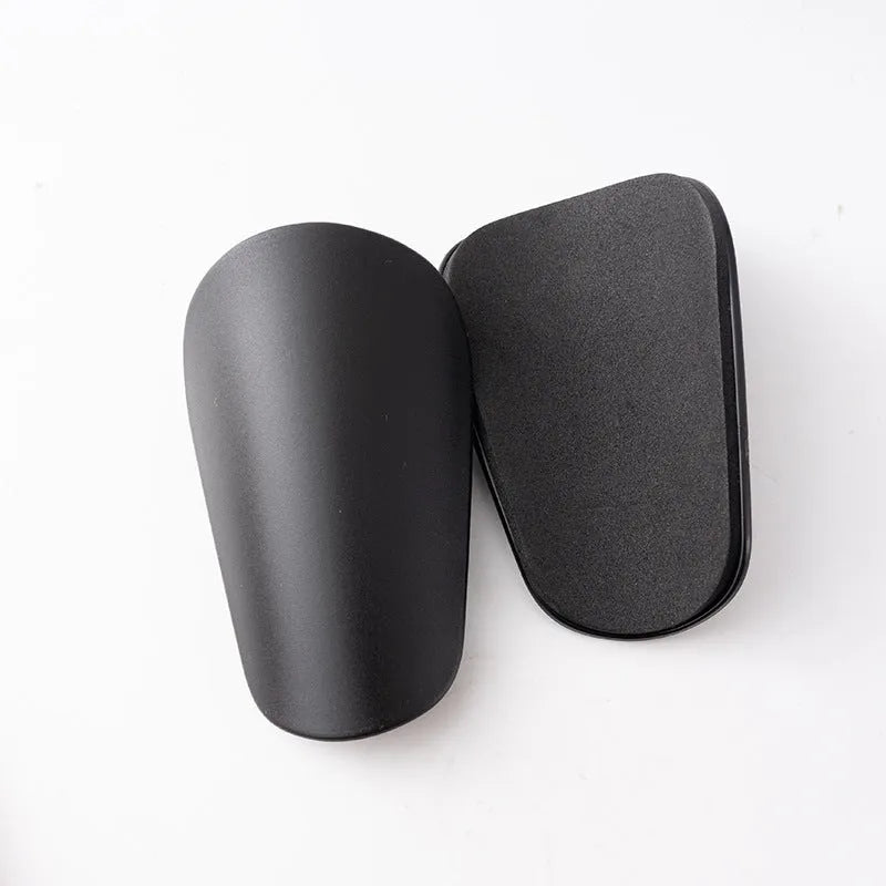 PU mini shin guards for football and sports, shown in black, white, red, and blue colours.