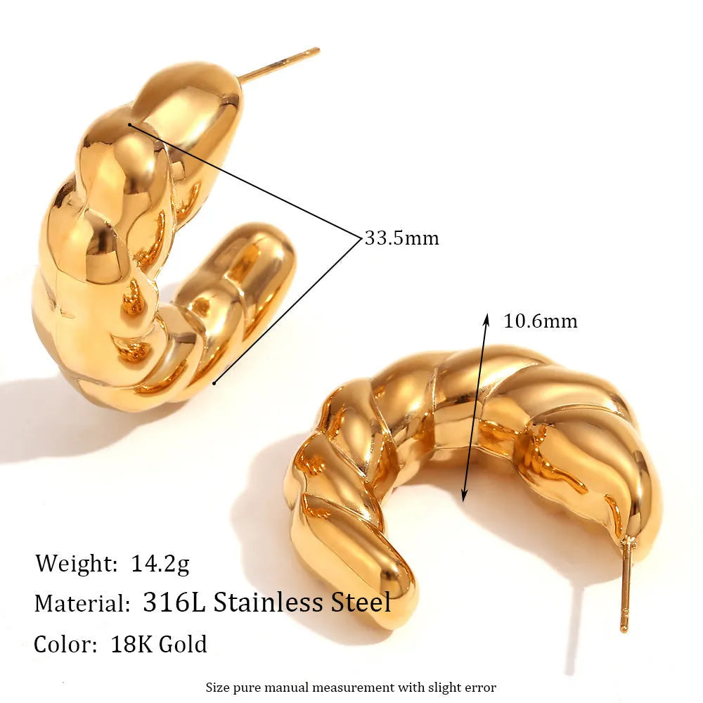 Stainless steel retro geometric oval stud earrings with electroplated finish on white background