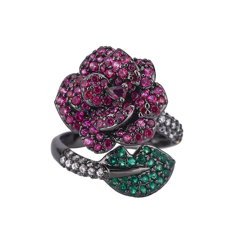 Gold-plated geometric flower ring with red simulated corundum stone on black gold band