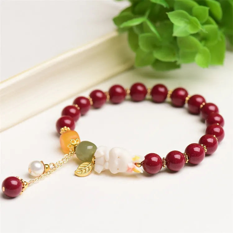 Natural cinnabar bracelet with rabbit motif in traditional Chinese design