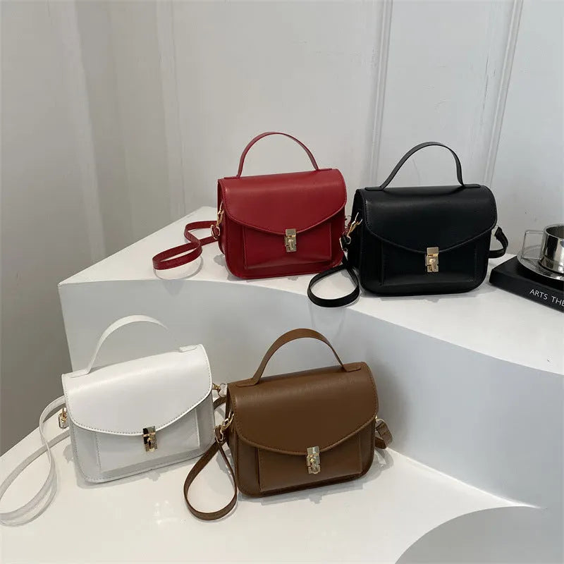 Retro style PU messenger bag in horizontal square format with sandwich pocket and crossbody strap