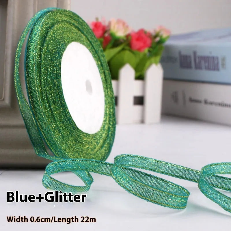Roll of 0.6cm wide polyester gift ribbon in various colours including gold leaf, coffee and sky blue options