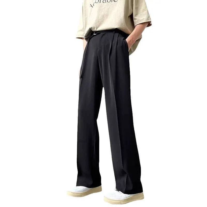Thin straight leg black wide trousers with non-ironing finish and loose fit casual style