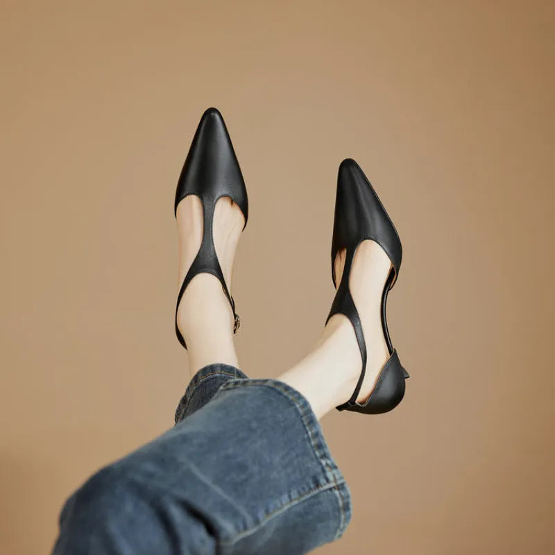 Women's vintage brown high heel shoe with a pointed toe and cowhide upper