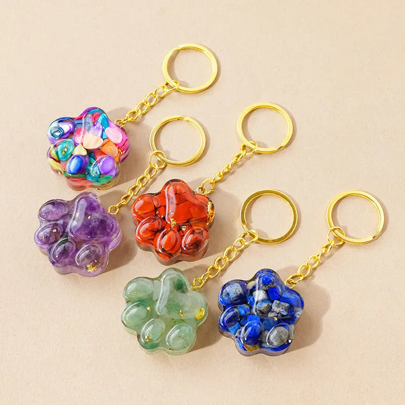 Natural crystal cat's paw keychain pendant in assorted gemstone colours on a keyring.