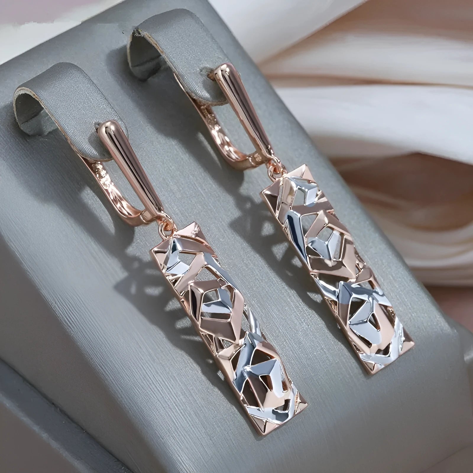 Rectangular two-tone hollow stud earrings with geometric shape and electroplated finish