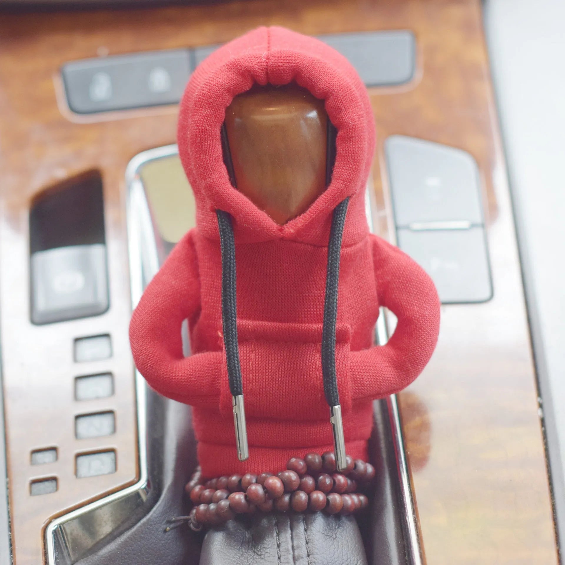 Dutch velvet car gear handle sleeve cover in multiple colours on a car gear lever.