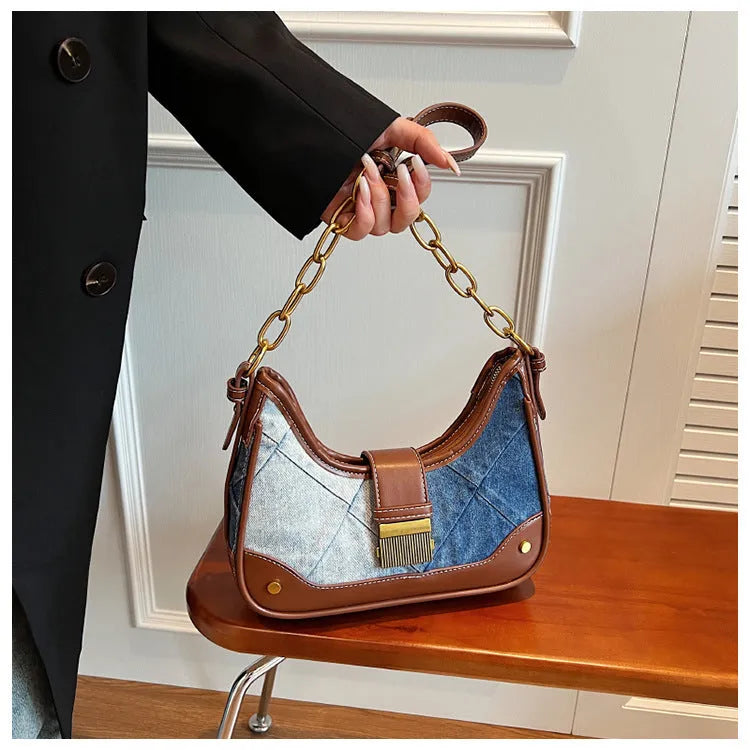 Brown denim bucket shoulder bag with diamond mesh pattern and chain decorative elements