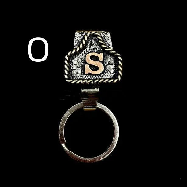 Handmade stainless steel cow tag belt key holder with engraved number plate on a split ring.