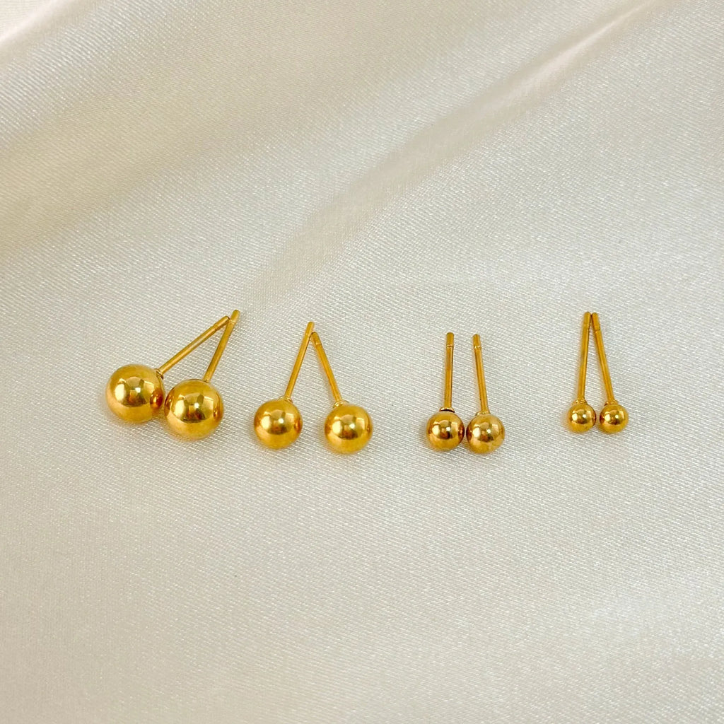 Stainless steel ball stud earrings in gold and silver finishes, showing 3mm to 6mm size comparison