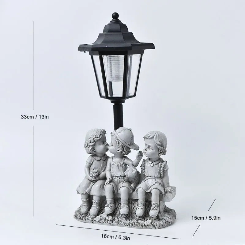 Solar hexagonal garden lamp with decorative resin figurine on plastic base for outdoor pathway lighting