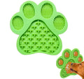 Blue bone-textured silicone dog licking mat with suction cups on back, shown on a tiled wall.