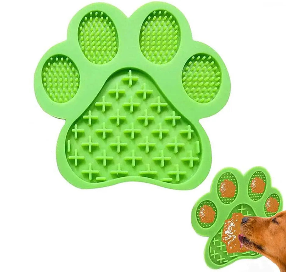 Blue bone-textured silicone dog licking mat with suction cups on back, shown on a tiled wall.