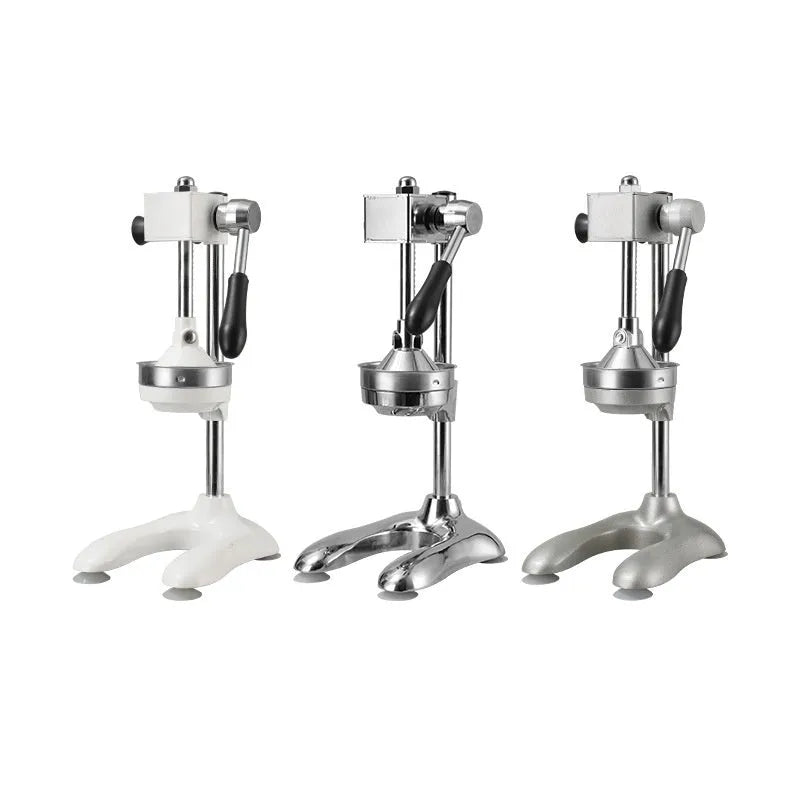 Stainless steel manual vertical citrus juicer on a countertop, showing optional colour finishes and head styles.