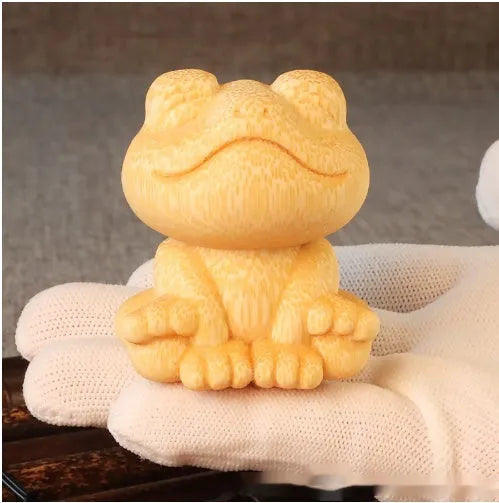Smiling frog solid bamboo carving ornament measuring 5cm high with cartoon cute style