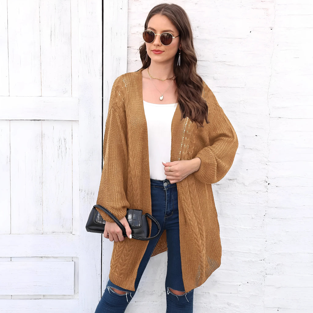 Women's loose acrylic sweater coat in solid colour on hanger