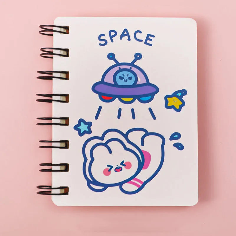 Astronaut flipped portable pocket notebook showing space-themed cover designs at 10.5 by 8 cm size