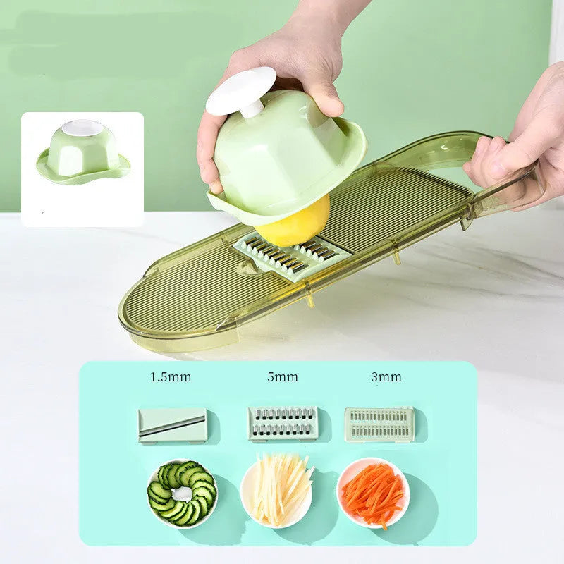 Transparent green vegetable cutter with stainless steel blades and optional drain basket