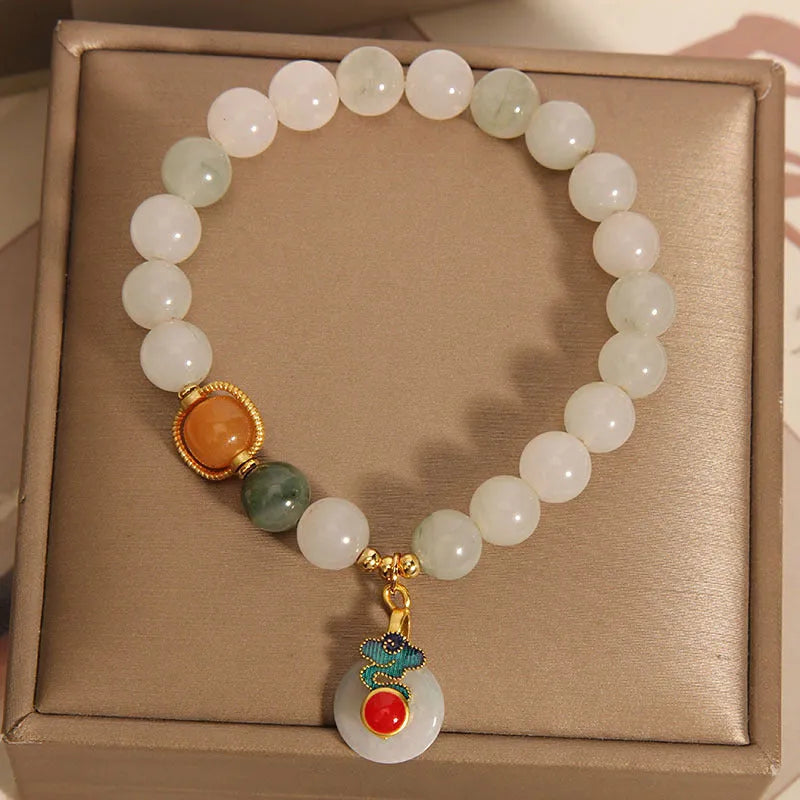 Women's genuine jade bracelet with an ice jade Xiangyun peace buckle and pearl decorative accents.
