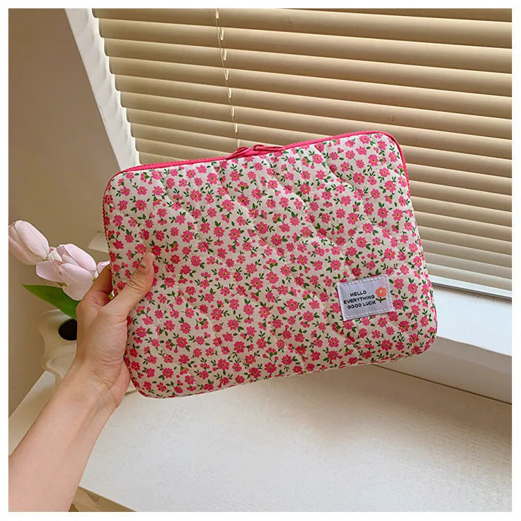 Women's printed cloth laptop bag with floral pattern showing anti-shock protection and storage compartments