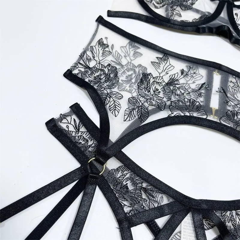 Black women's lace three-piece set with floral print, showing top, pants, and waist ring