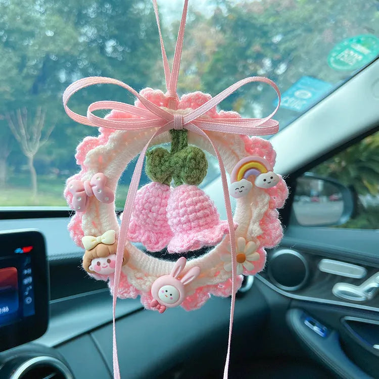Woven wool bell orchid car pendant in green, pink, purple, and yellow colour options with dream catcher variations