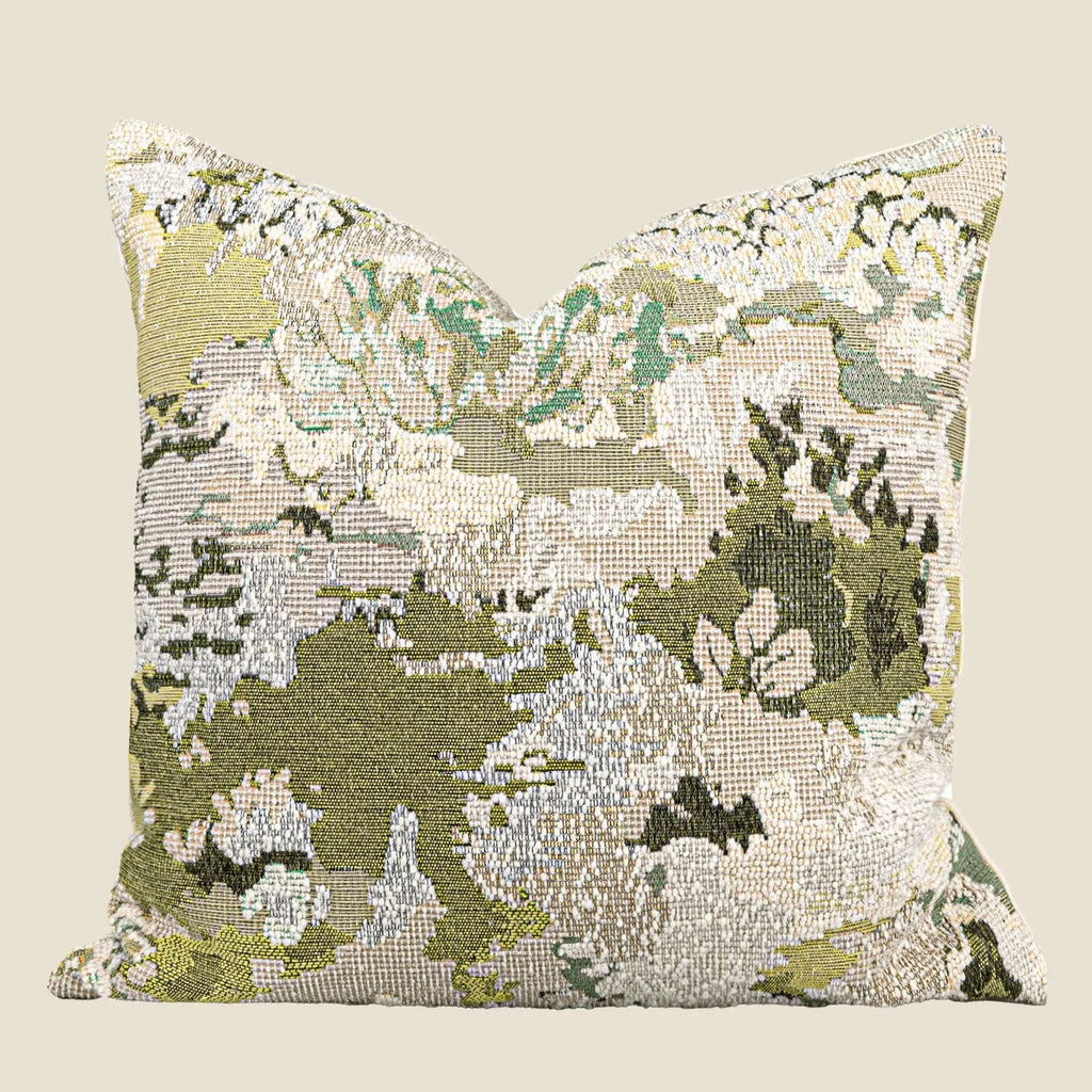 Antique green wool blend cushion with abstract spring flowers pattern, shown in square and lumbar sizes.