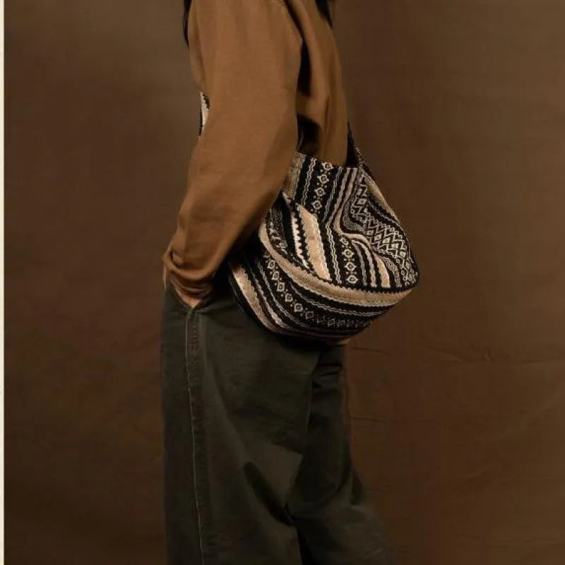 Retro striped corduroy messenger bag with vintage handprint detailing and adjustable plaid shoulder strap