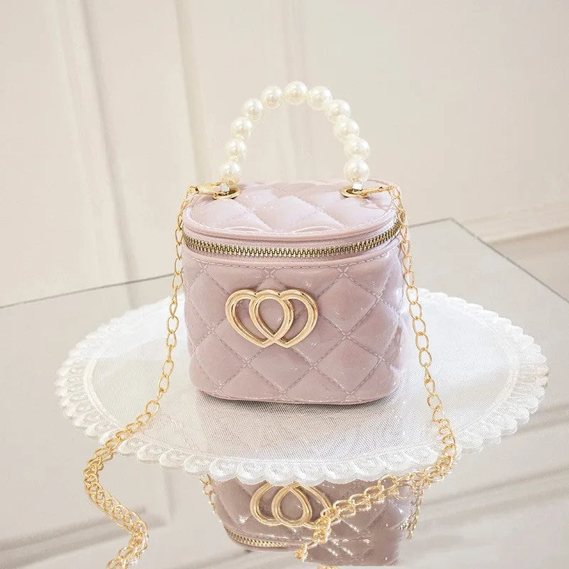 Transparent PVC bucket bag with a heart pattern, shown in one of seven available colours.