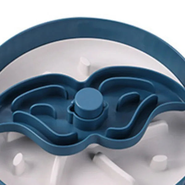 Rotating pet food bowl with silicone slow feeder mat in blue with windmill pattern design