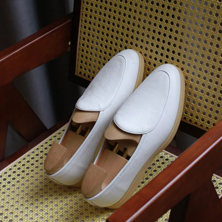 Men's brown genuine leather LP flat loafers with a low cuff, shown on a white background.
