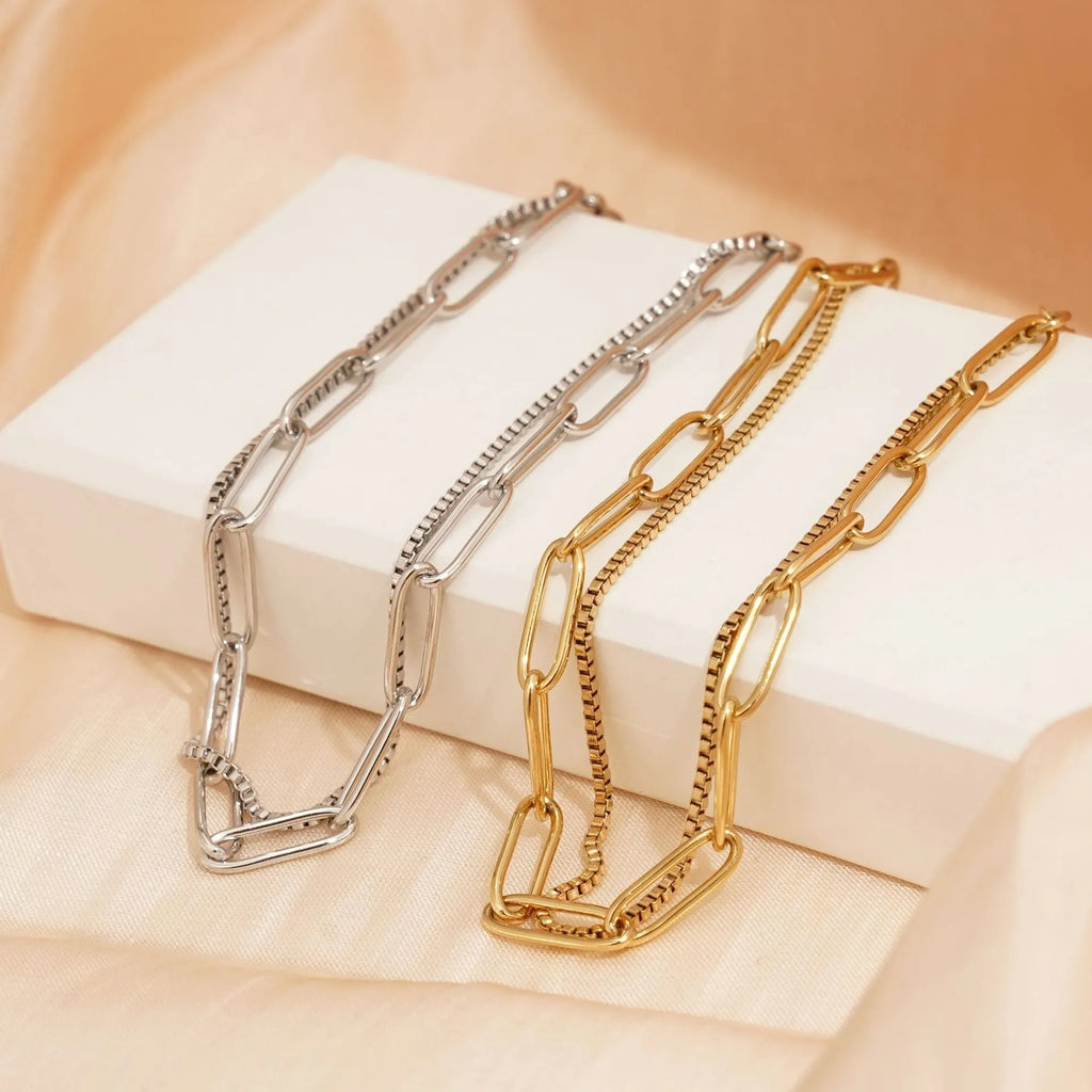 Gold and silver geometric double-layer stainless steel women's bracelet with linear design.
