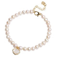 Women's freshwater pearl bracelet with fan-shaped alloy clasp, shown with both elastic and chain fastening options.